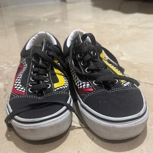Vans Stylish Black Sneakers with Red and Yellow Accents